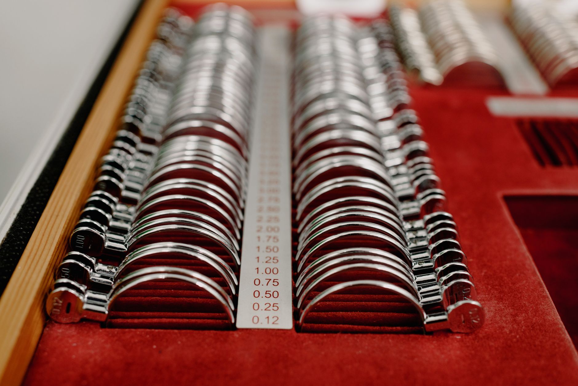 Rows of trial spectacle lenses arranged in a case